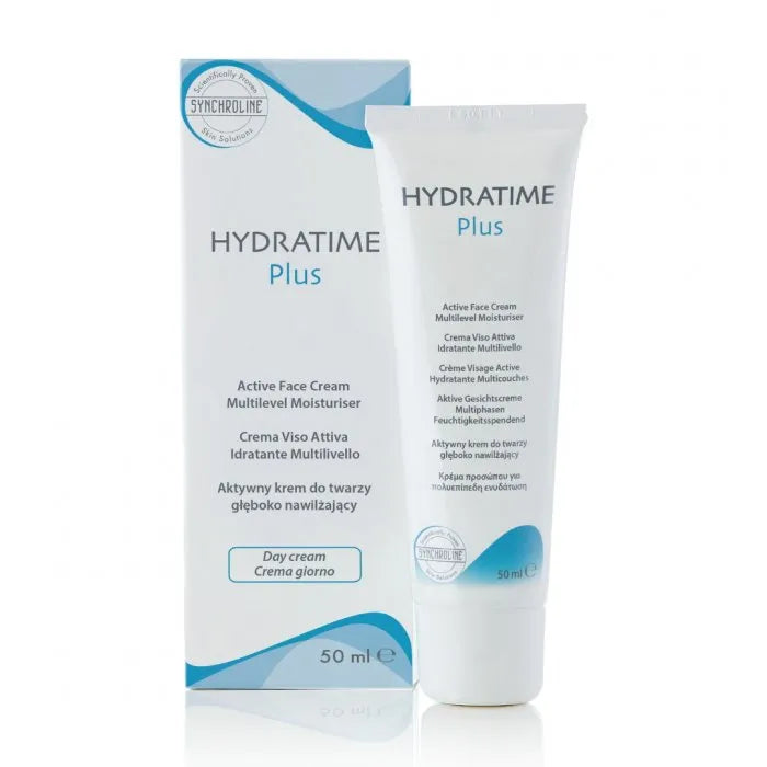 A tube of HYDRATIME PLUS FACE CREAM Dry Skin Moisture Treatment next to its packaging box. The packaging is predominantly white with blue text and accents, highlighting the product name and features.