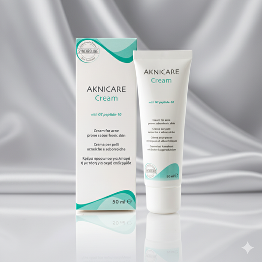 Aknicare Cream clear skin acne treatment tube and packaging on a gray background